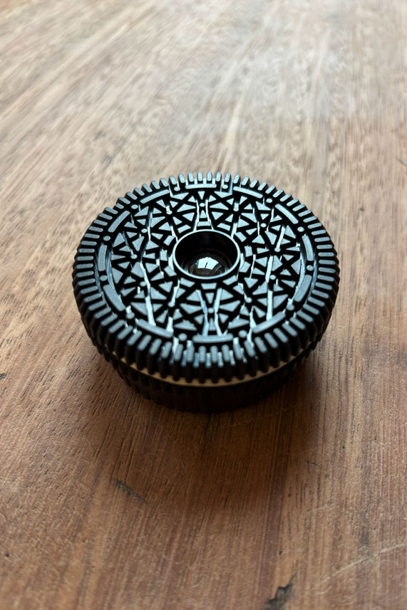 A lens that looks like an Oreo biscuit